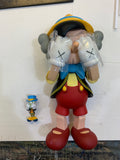 KAWS (B.1974) PINOCCHIO & JIMINY CRICKET PINOCCHIO estampillé '©Disney KAWS.. MEDICOM TOY 2010 CHINA