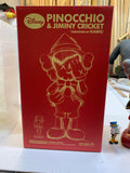 KAWS (B.1974) PINOCCHIO & JIMINY CRICKET PINOCCHIO estampillé '©Disney KAWS.. MEDICOM TOY 2010 CHINA